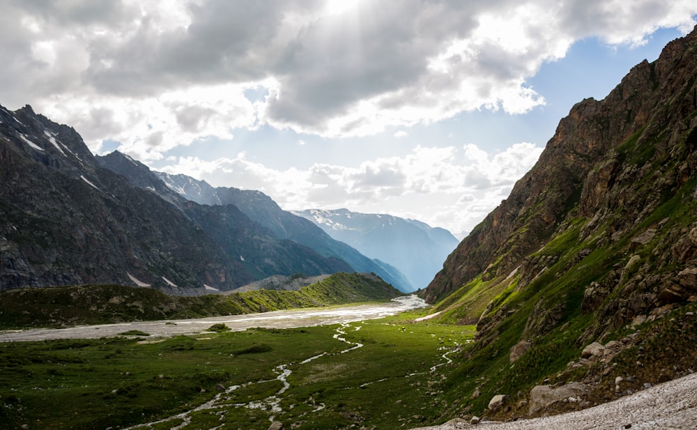 green mountains under white clouds during daytime