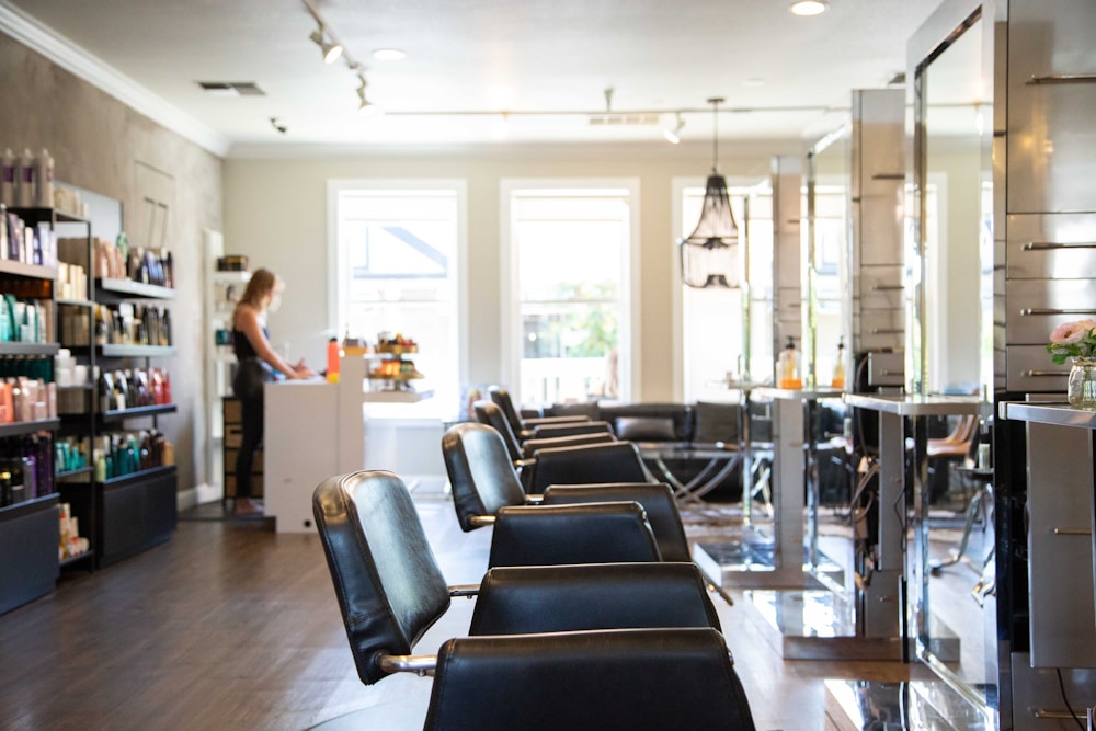 Salon chairs along a bright window
