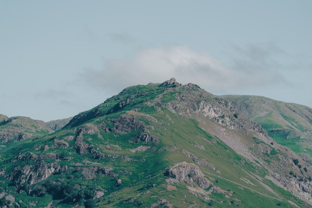 green and gray mountain under white sky during daytime