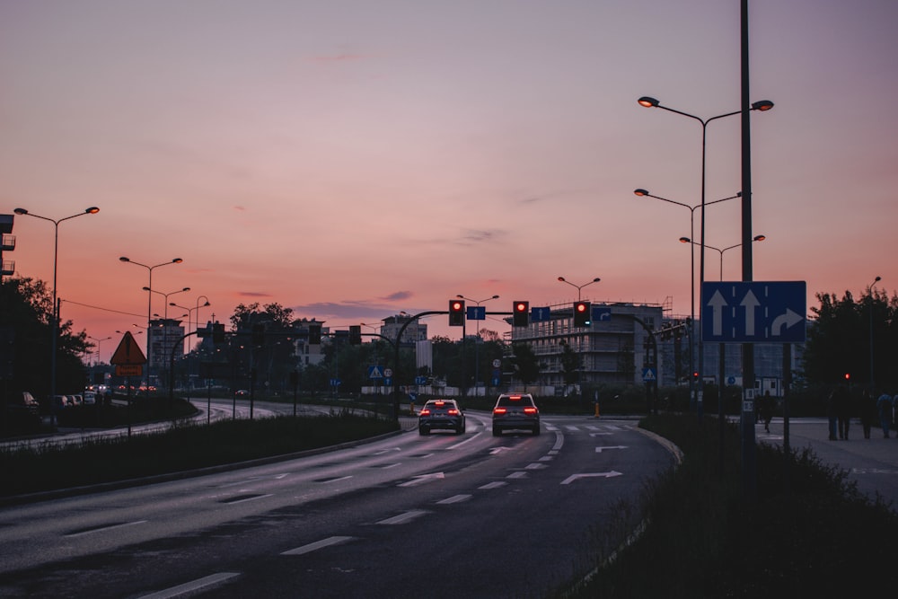 cars on road during sunset