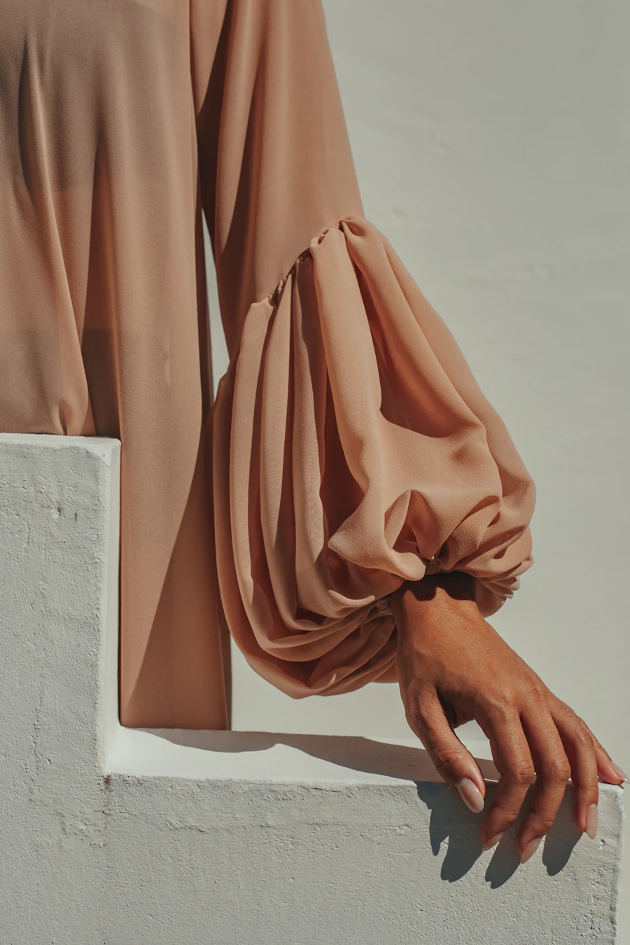 Tan silk bishop sleeve in golden light — Studio Rahaf