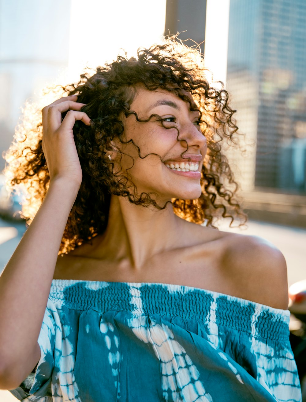 woman in blue tube dress smiling