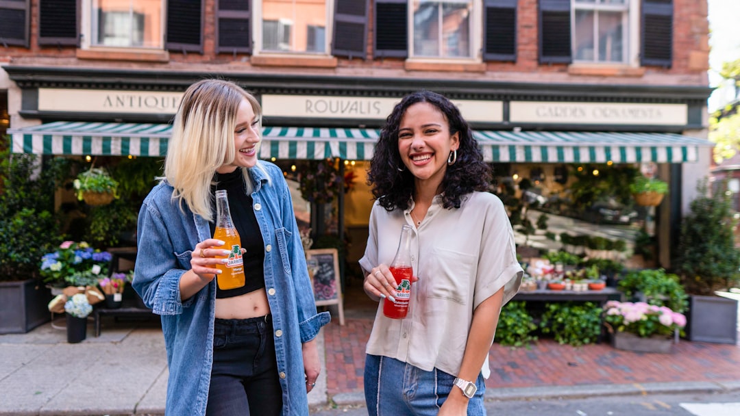 picture of two girls having a drink outside a pub