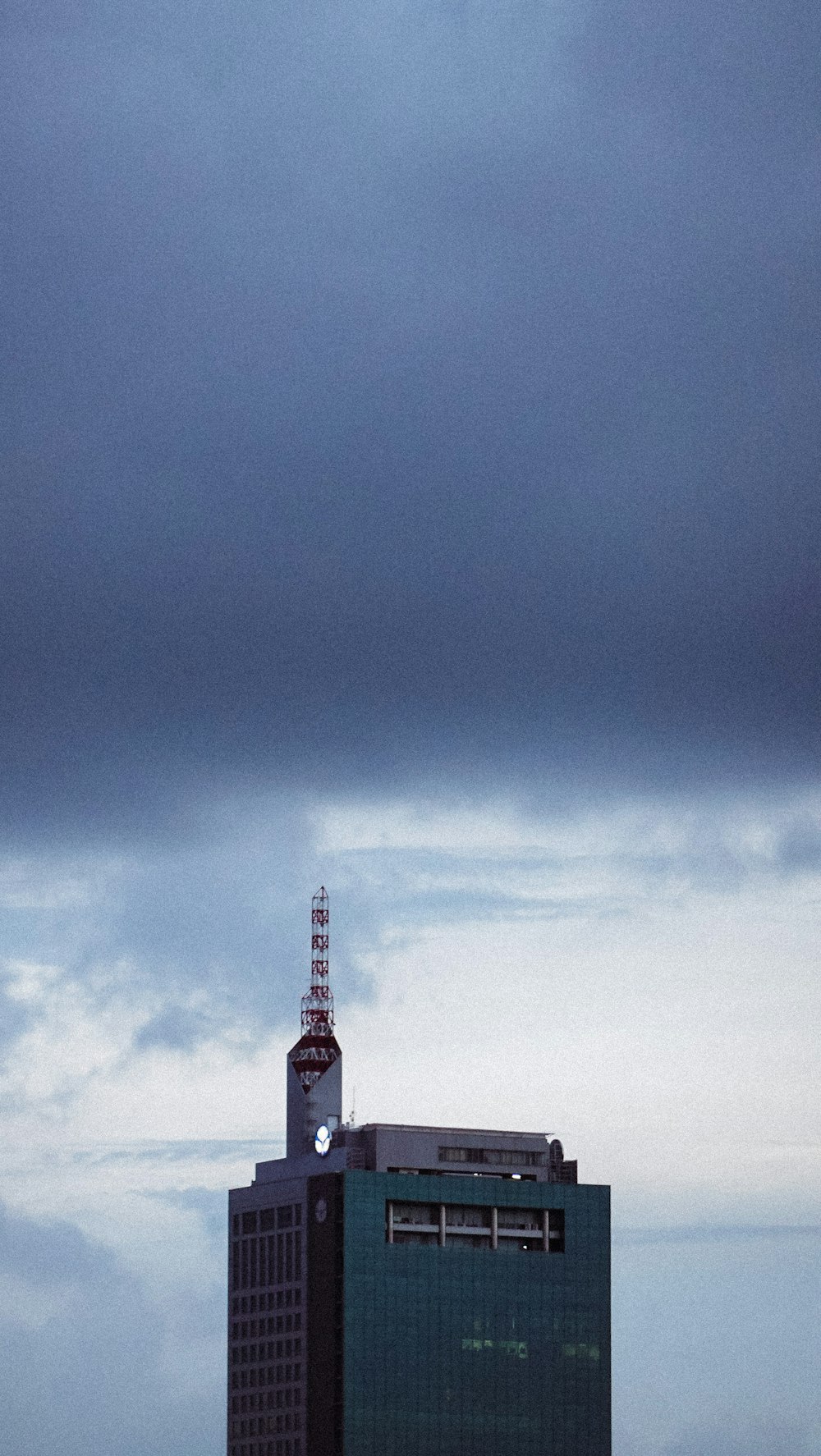 white and black tower under blue sky