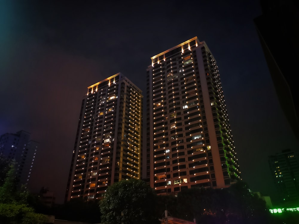 brown and black high rise building during night time
