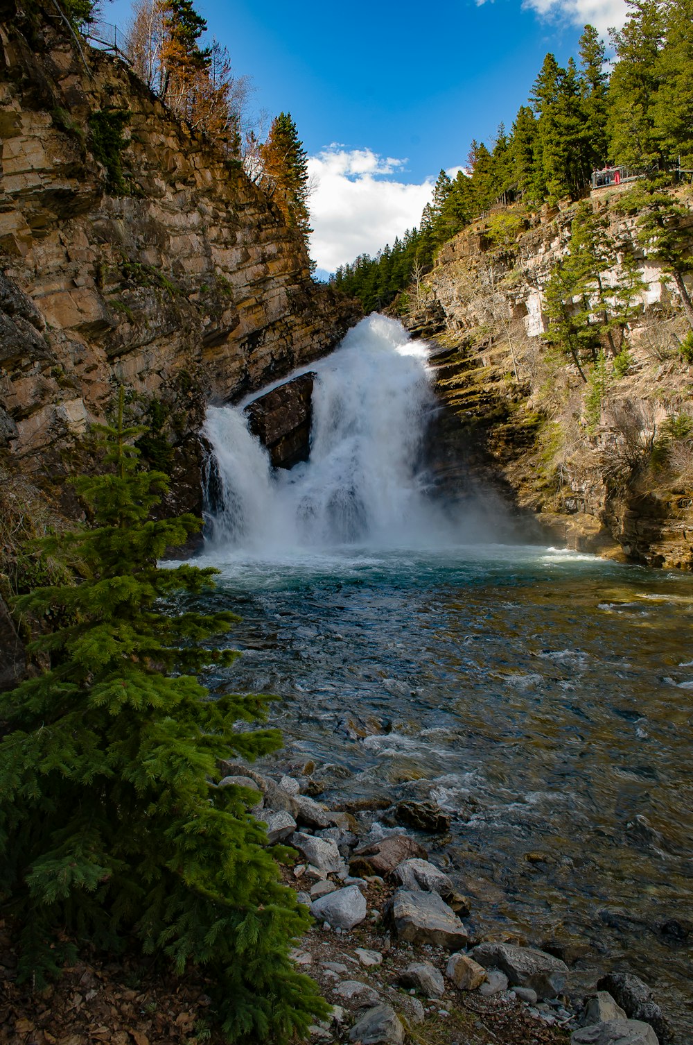 waterfalls on rocky mountain during daytime