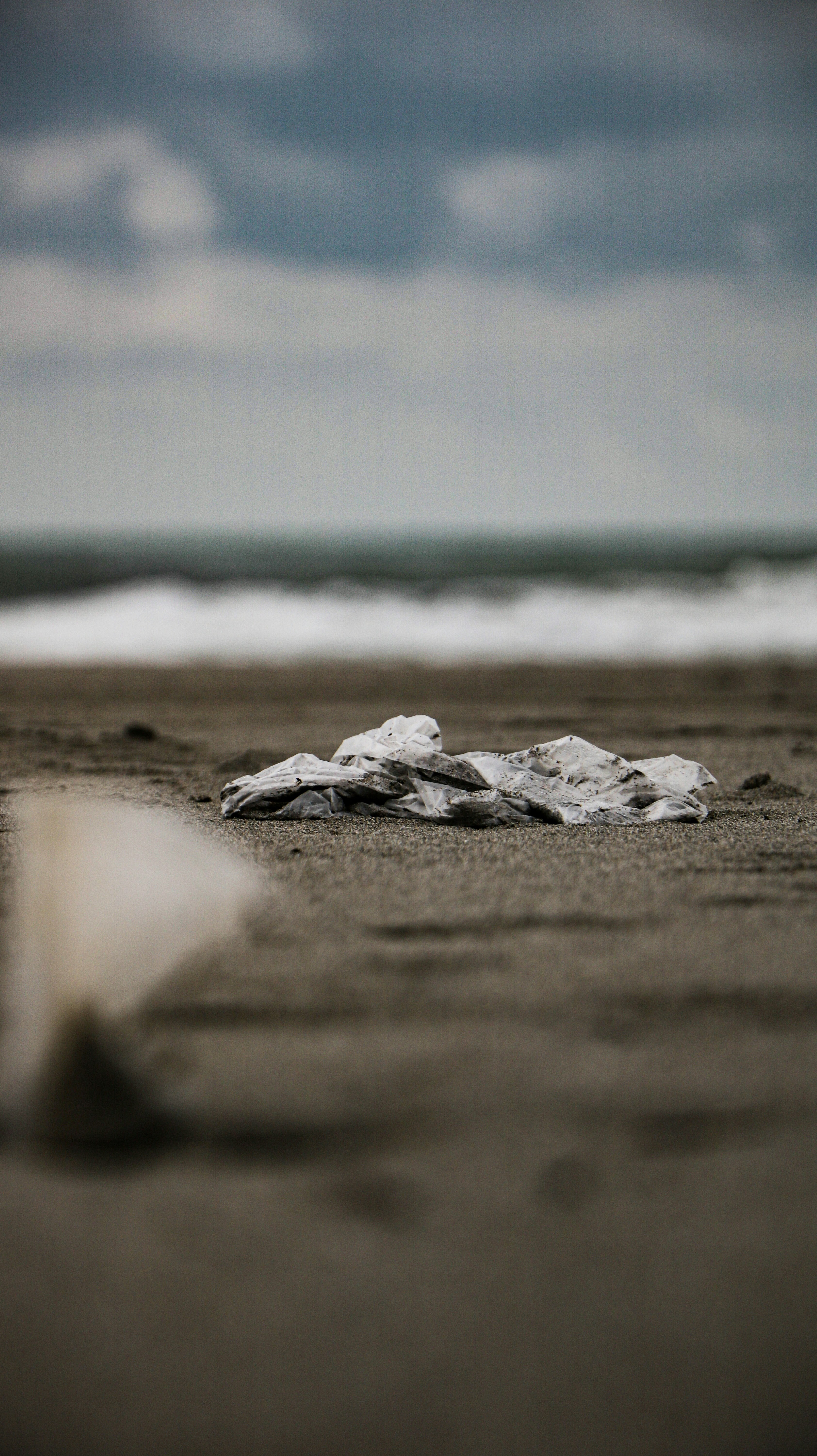 gray sand near body of water during daytime