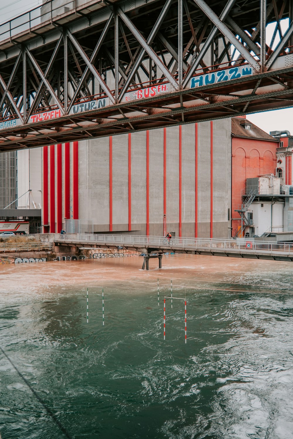 red metal bridge over water