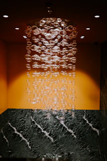 water droplets on black concrete wall