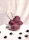 Colorful fruit sorbet scoops arranged in a bowl with fresh berries around