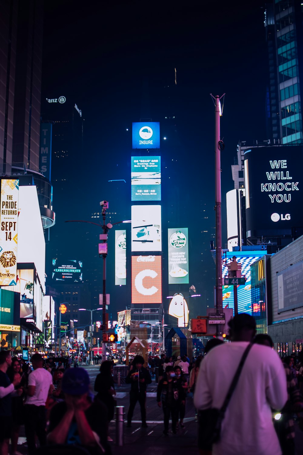 people walking on street during nighttime