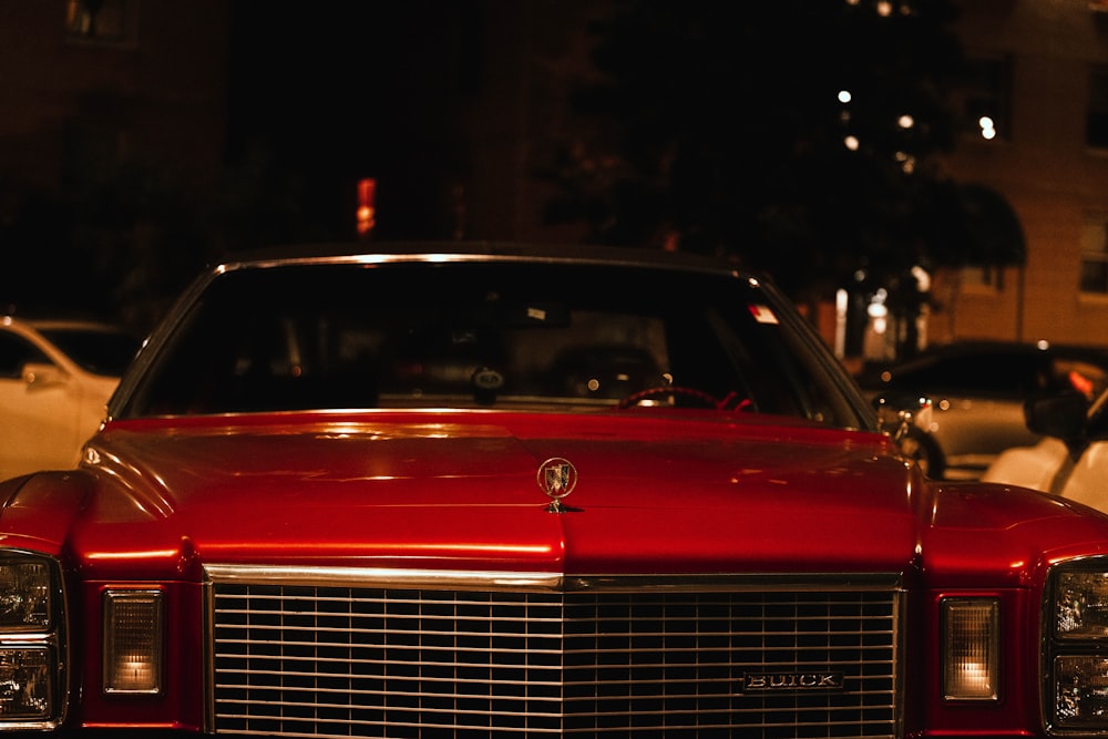 red mercedes benz car in a dark room