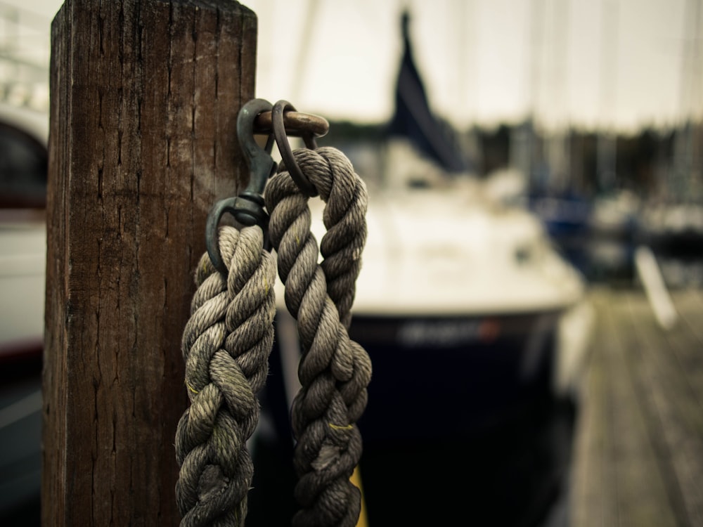 gray rope on brown wooden post