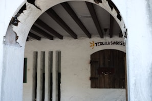 Rustic interior of a Texas honky tonk with wooden floors and patrons dancing