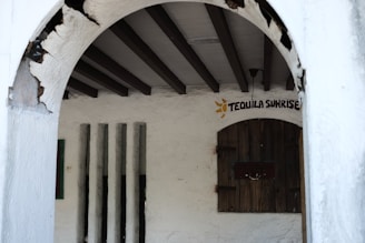 Rustic interior of a Texas honky tonk with wooden floors and patrons dancing