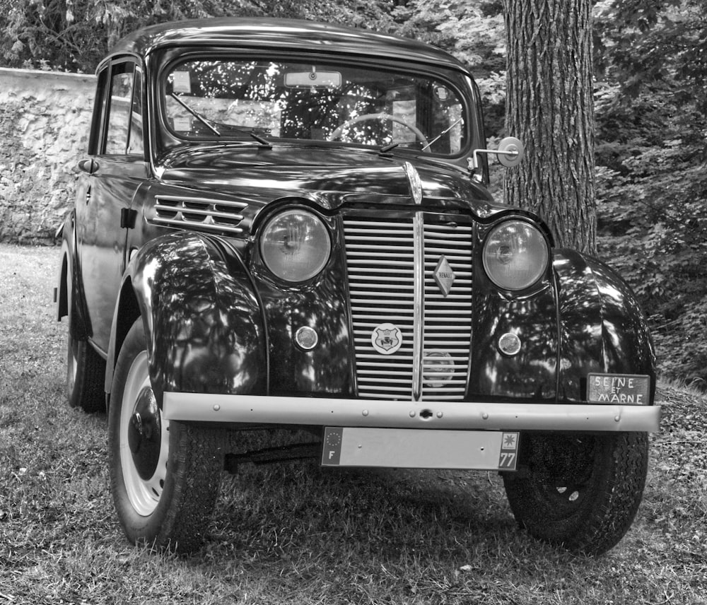 grayscale photo of vintage car