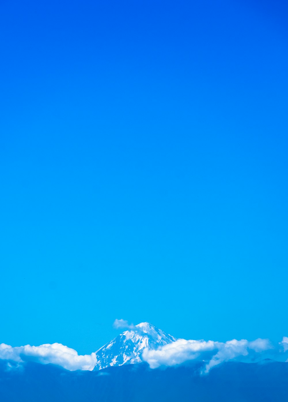 snow covered mountain under blue sky during daytime