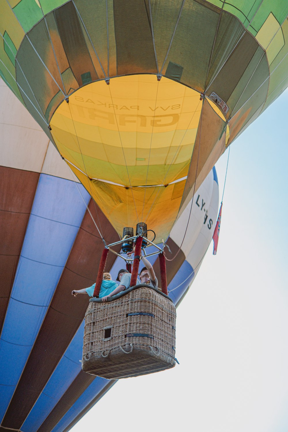 people riding hot air balloon during daytime
