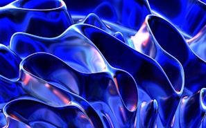 Abstract forms with fluid, wavy patterns in a metallic and glossy finish. Deep blues dominate with hints of reflective iridescent highlights.