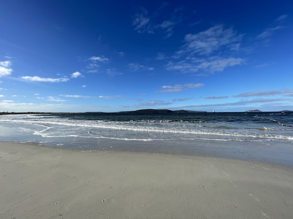 blue sky over sea shore