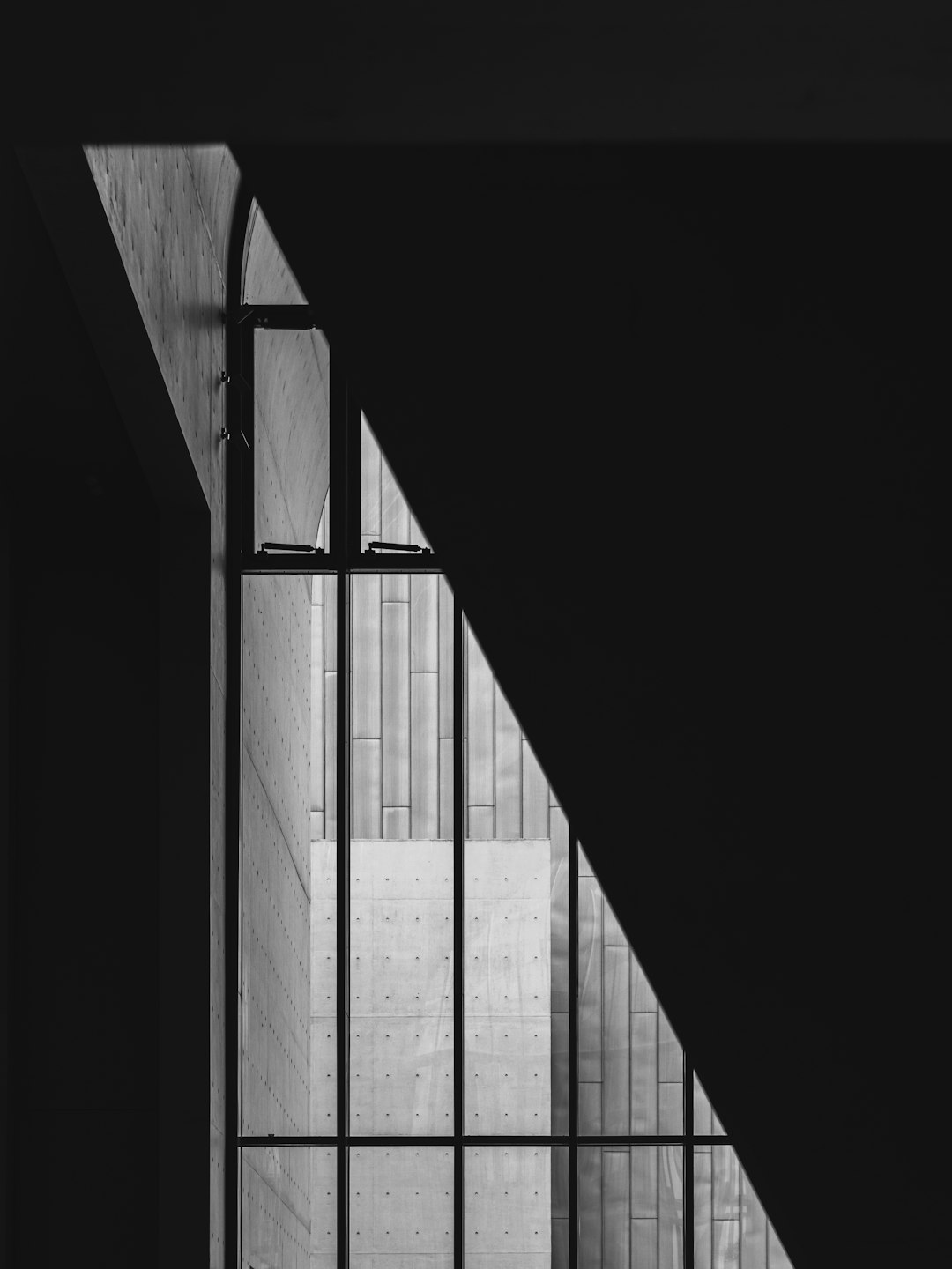 grayscale photo of a window