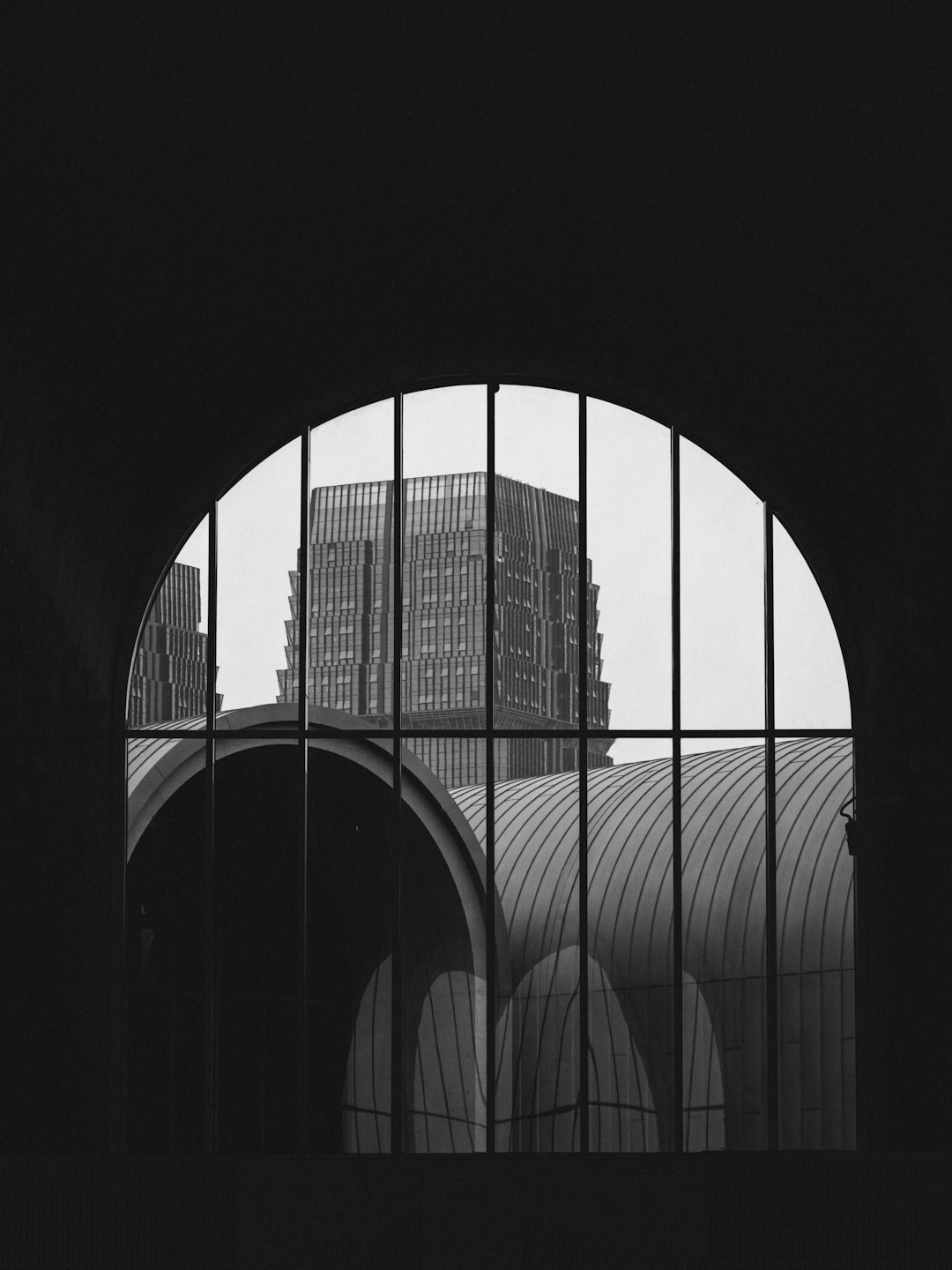 grayscale photo of metal gate