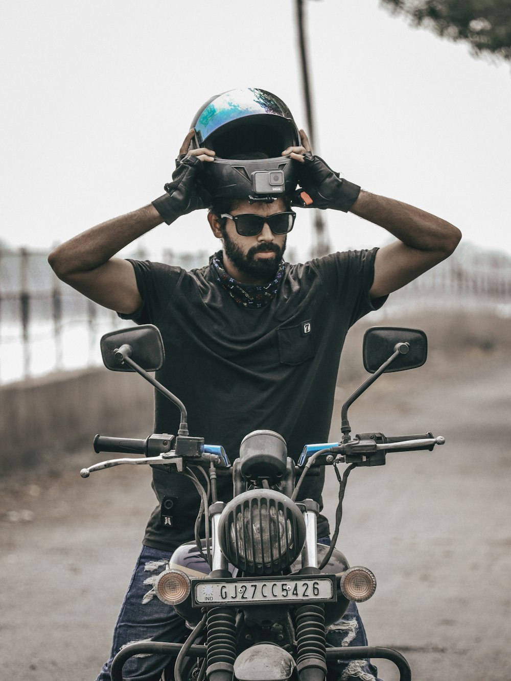 man in black helmet riding motorcycle