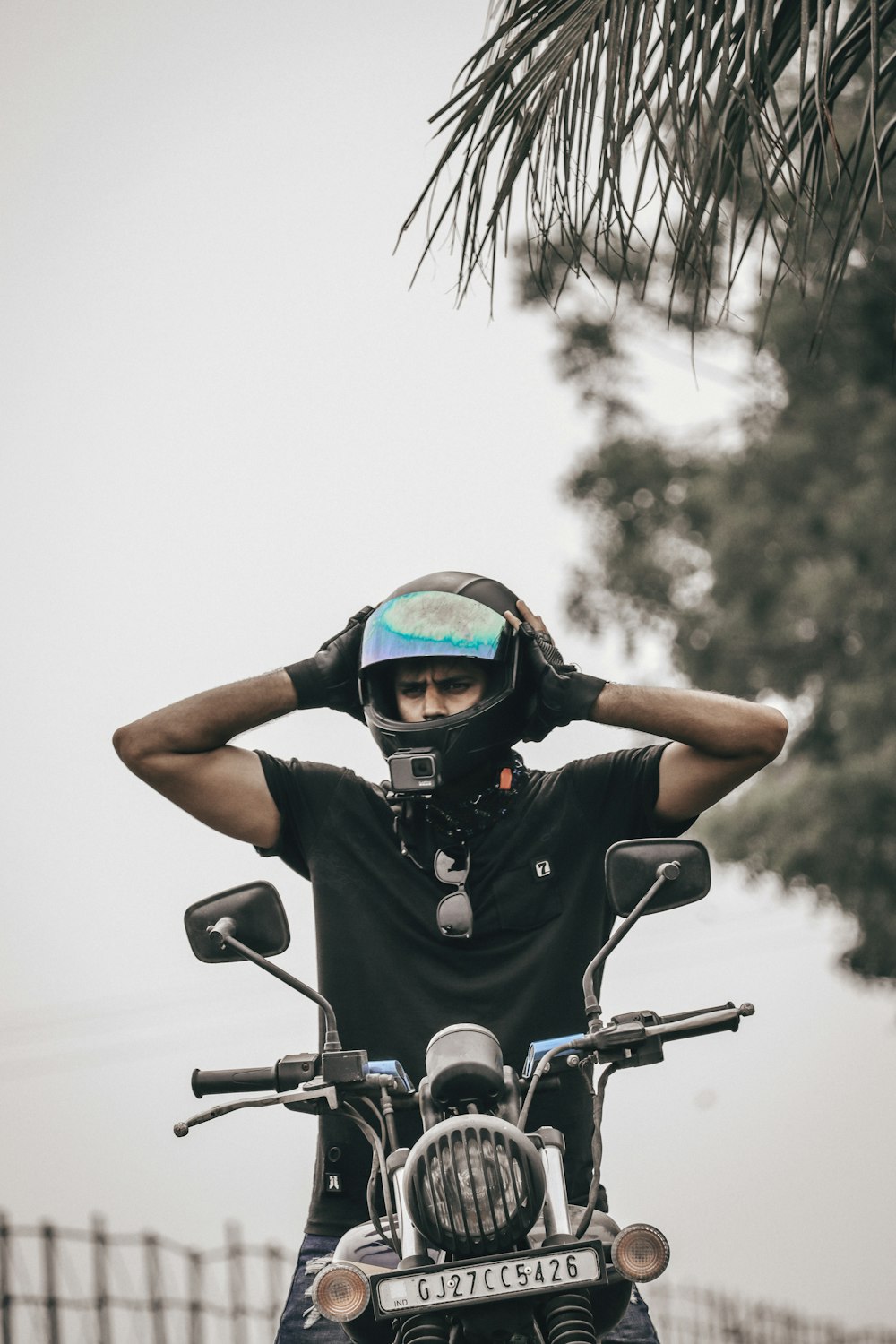 man in black helmet riding motorcycle