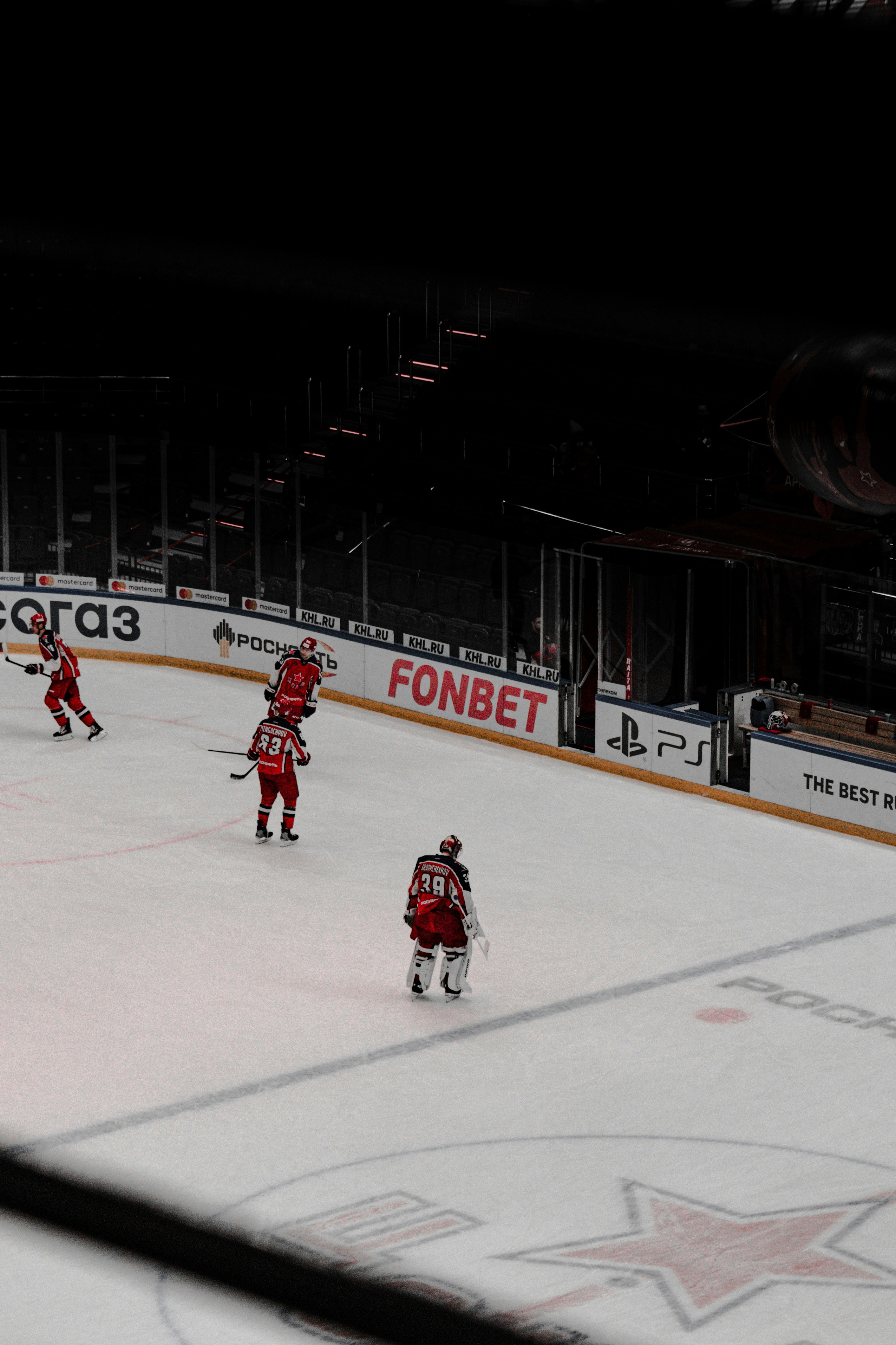 2 men playing ice hockey