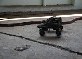 black stroller on gray concrete floor