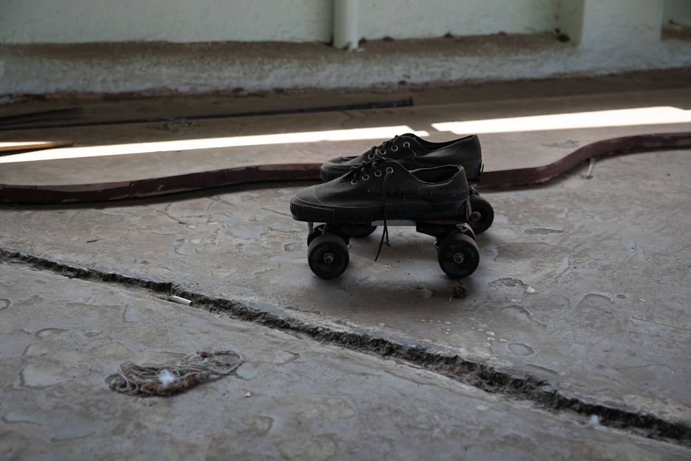 black stroller on gray concrete floor