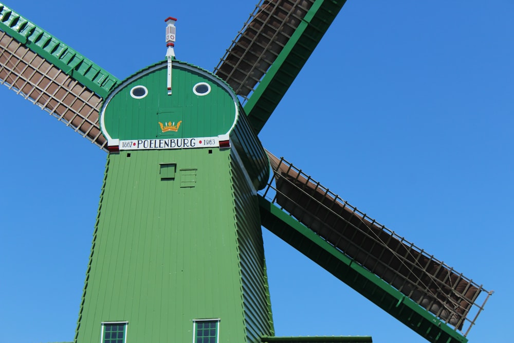 green and black building with green and red tower