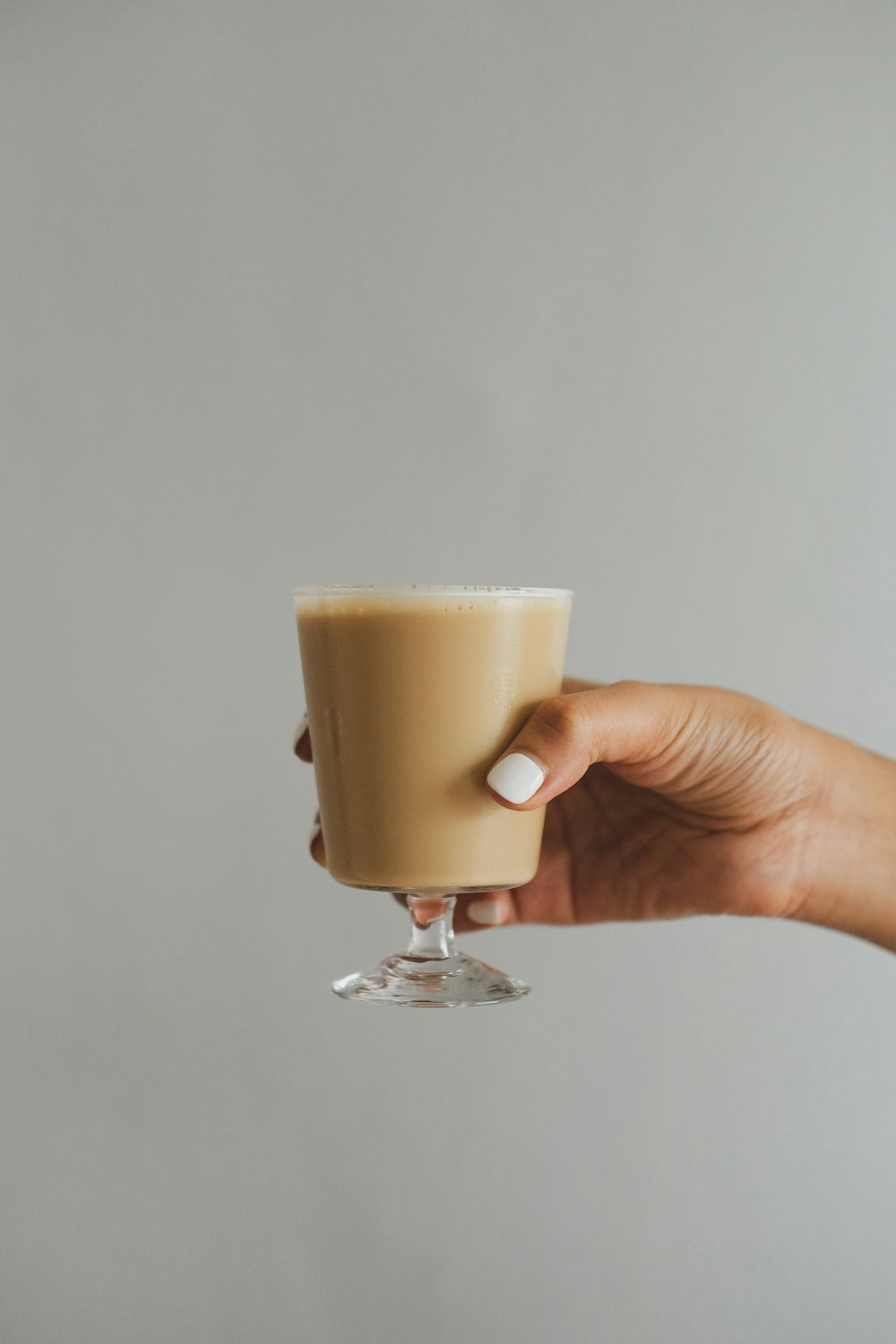 person holding white ceramic mug