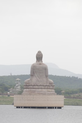 brown concrete buddha statue during daytime