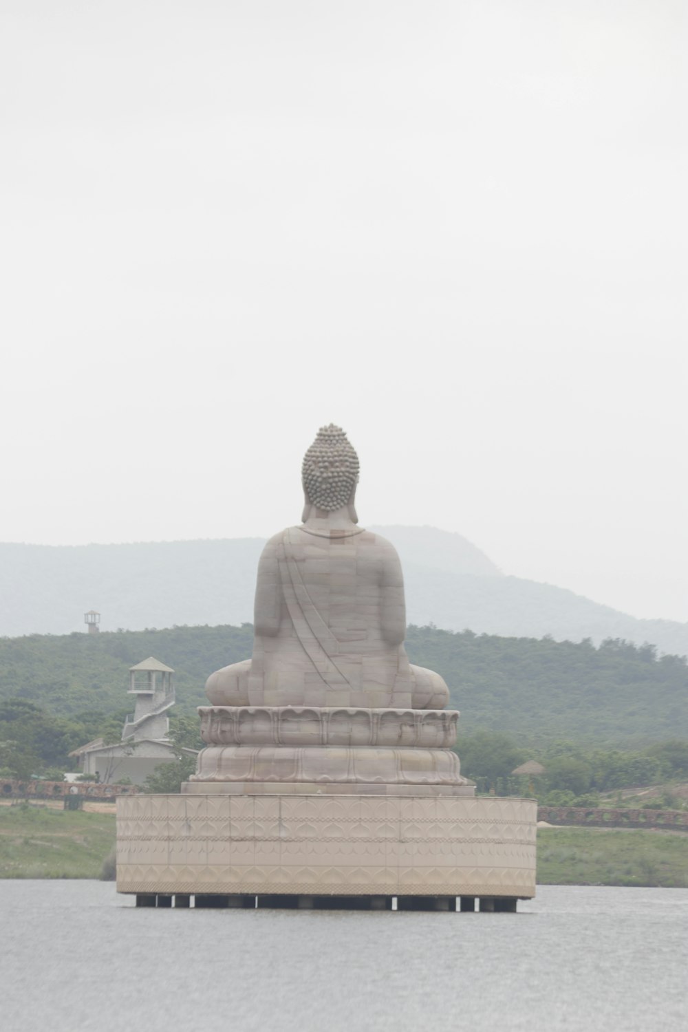 brown concrete buddha statue during daytime