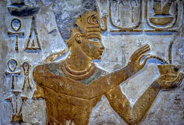 brown concrete statue of man