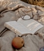 black framed eyeglasses on white book page