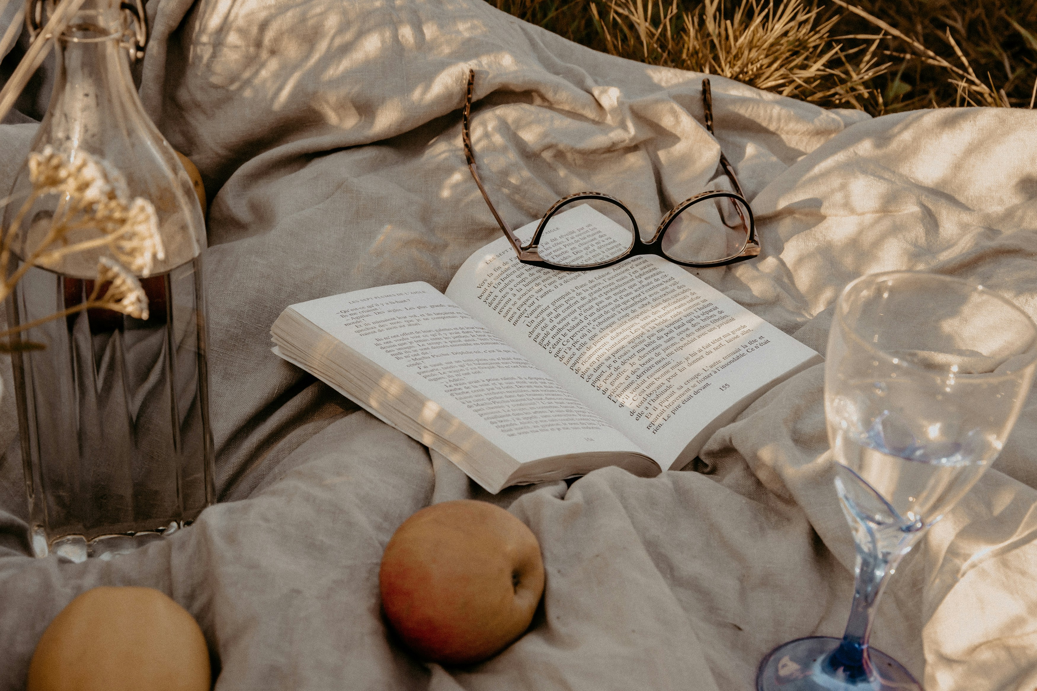 black framed eyeglasses on white book page