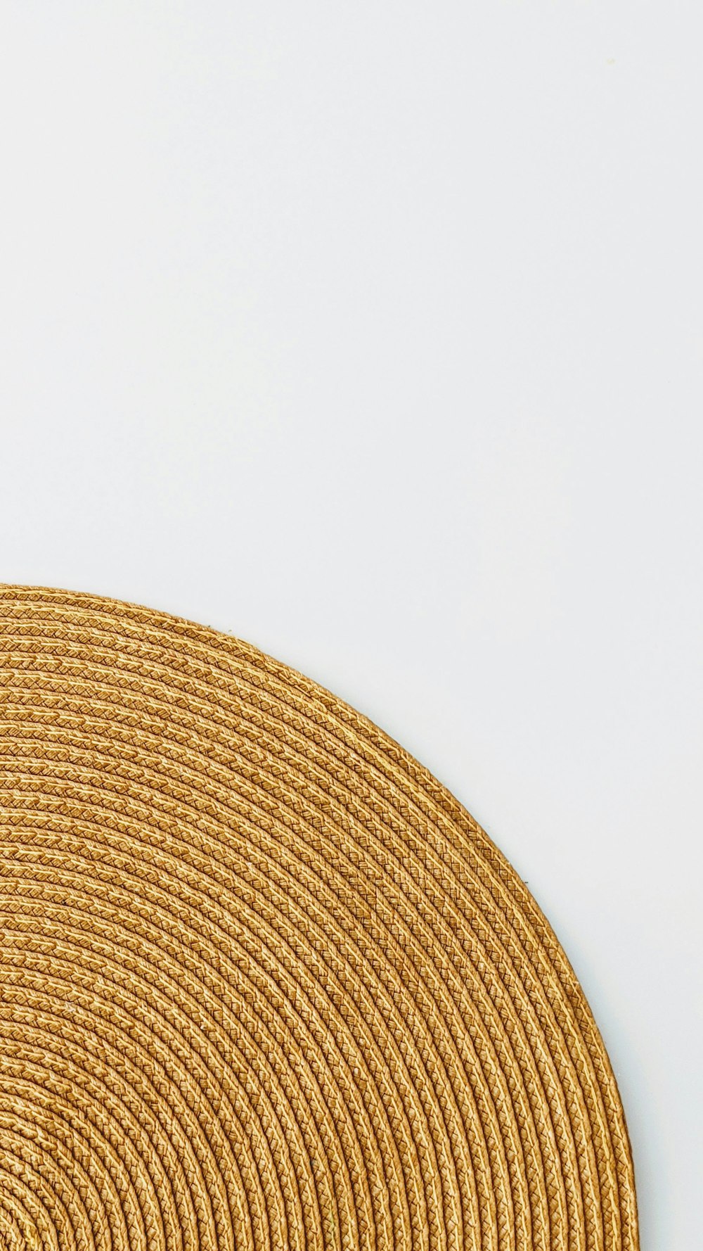 brown round textile on white surface