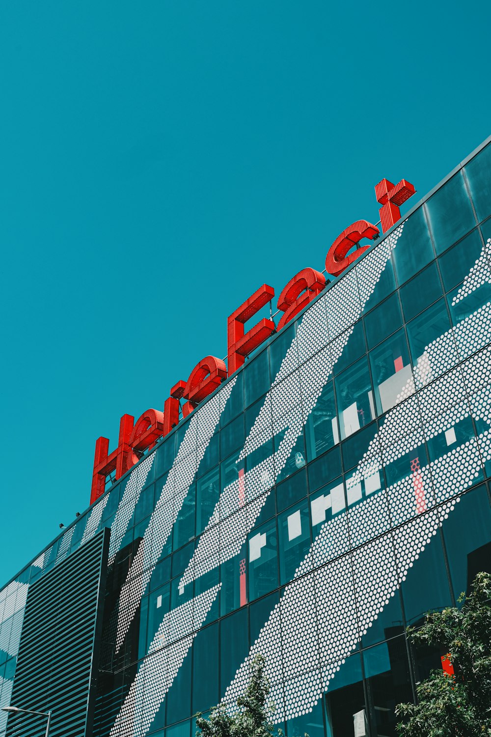 red and white concrete building under blue sky during daytime