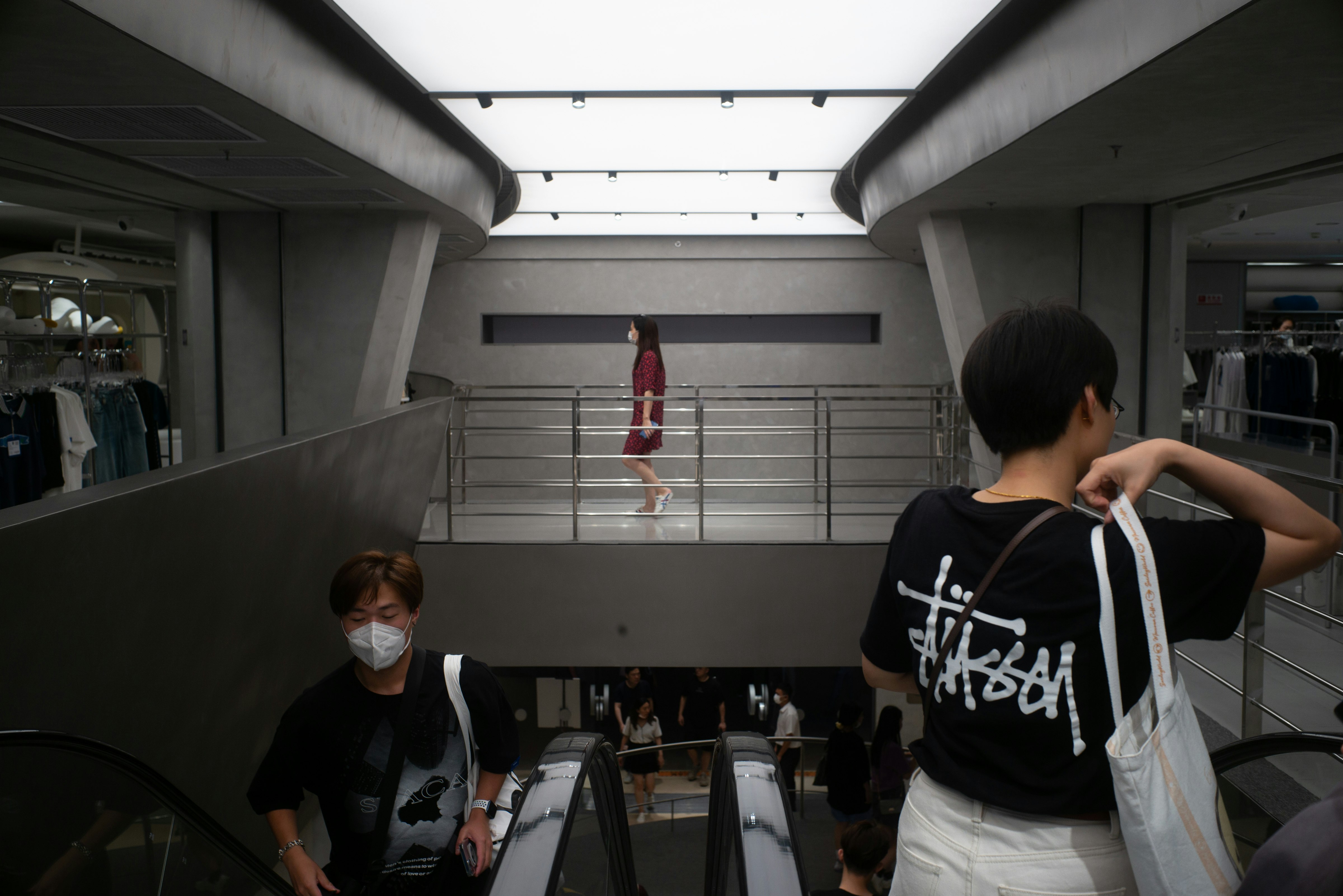 man in black and white crew neck t-shirt standing beside woman in white t-shirt