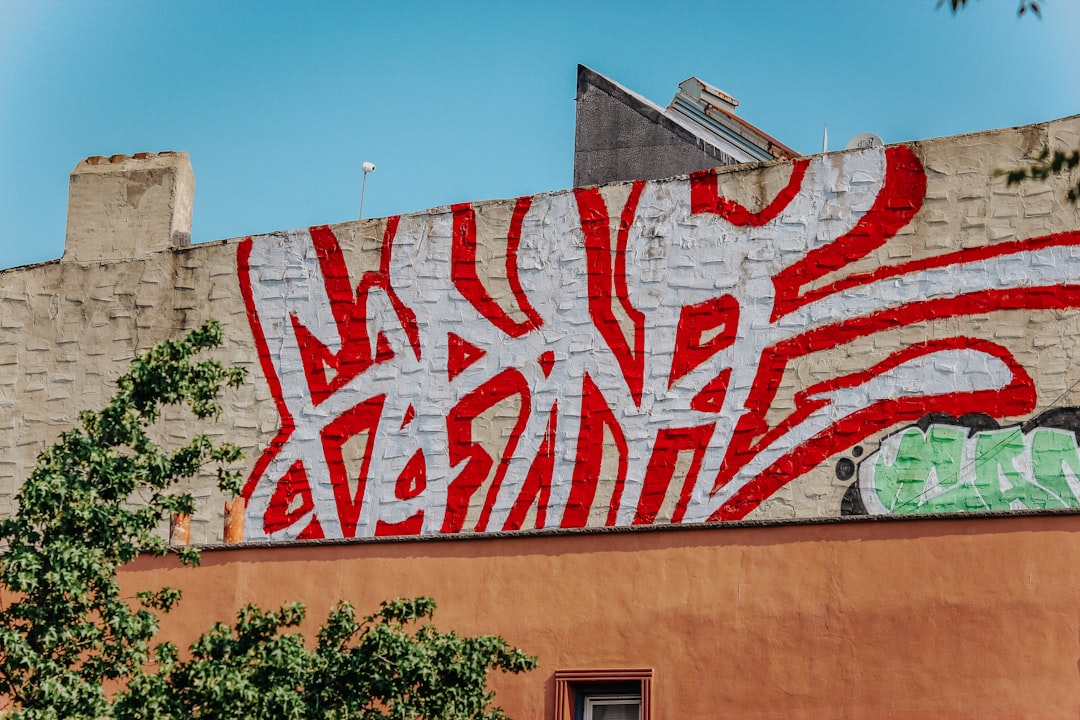 red and white coca cola wall graffiti