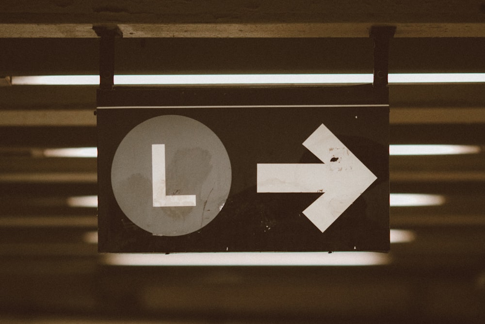 black and white arrow sign