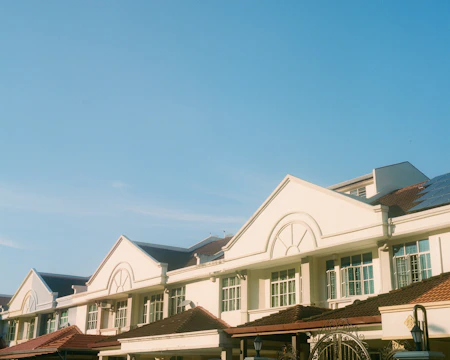 A row of charming suburban houses with well-kept gardens.