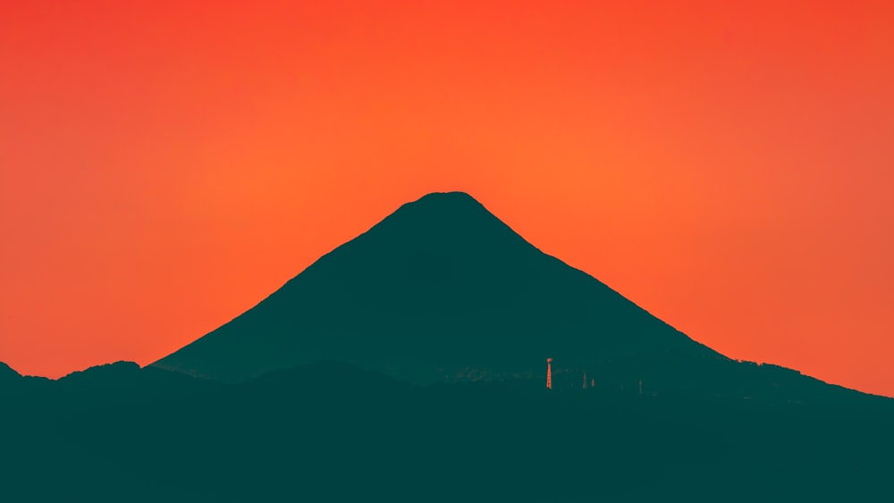 silhouette of mountain during sunset