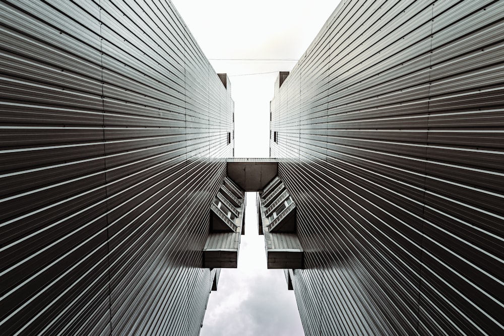 low angle photography of gray high rise building