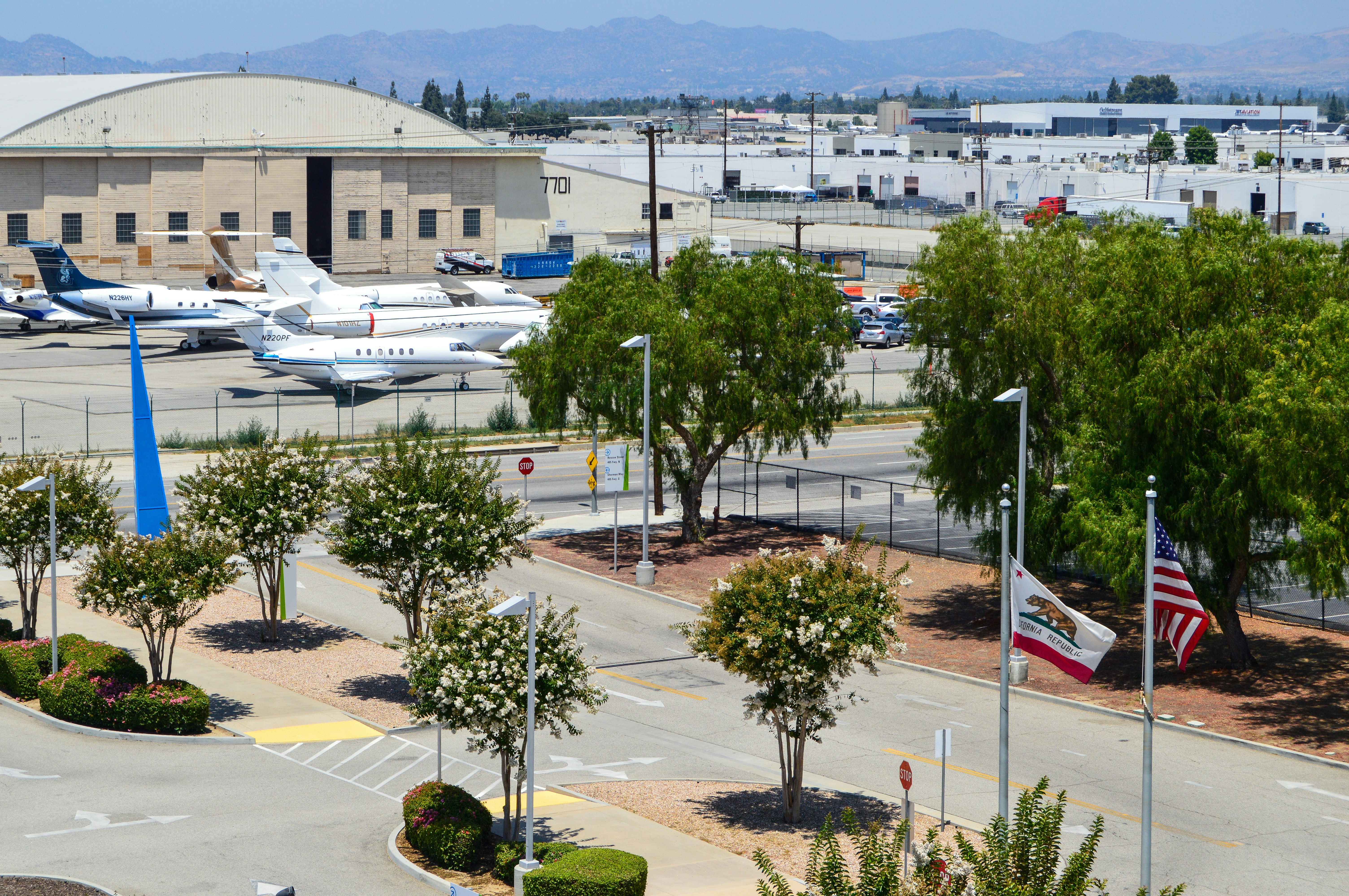 white airplane on airport during daytime, Van Nuys Private Airport from the Flyaway