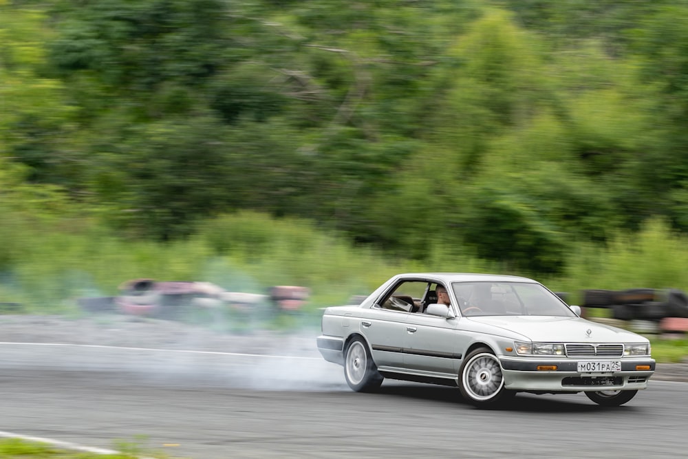 silver mercedes benz coupe on road during daytime