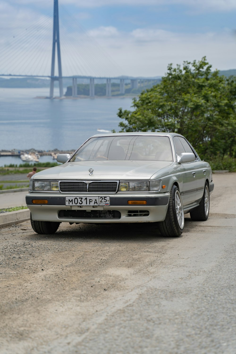 silver mercedes benz coupe on brown sand during daytime