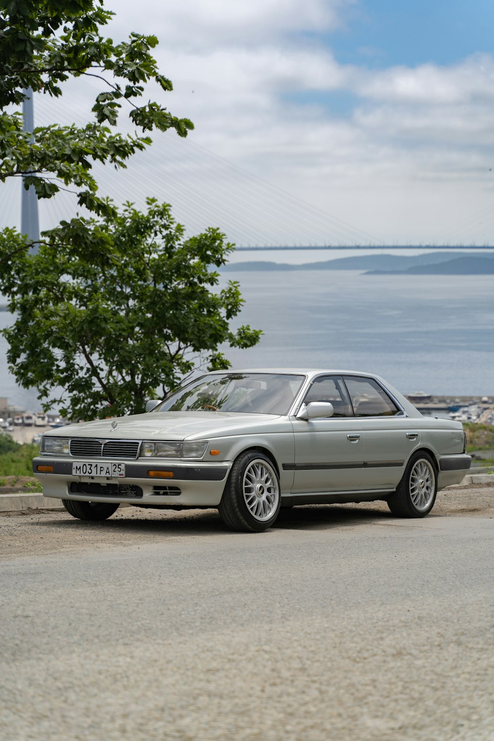 white mercedes benz sedan parked on beach during daytime